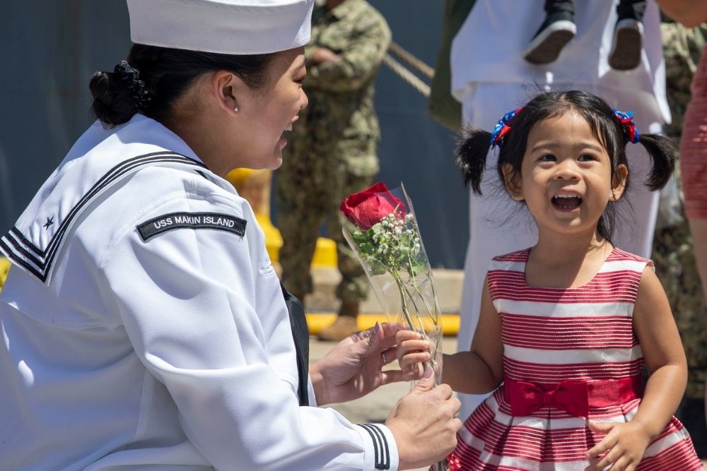 Jasmin Trias greets her family after seven month deployment